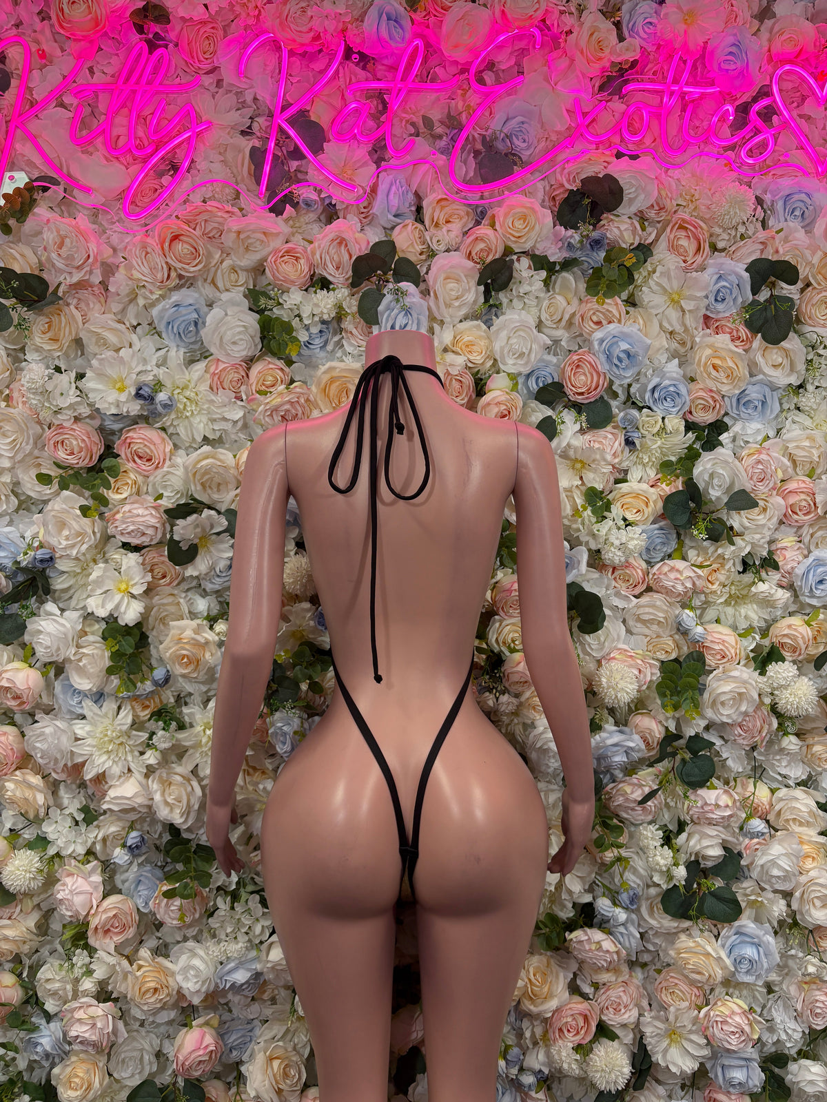 Metallic gold-and-black strappy cutout bodysuit, back view with thin halter straps