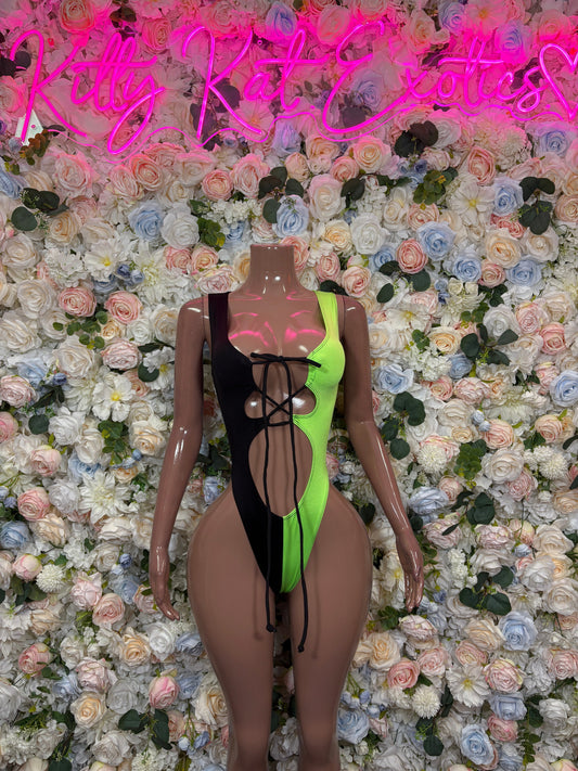 Neon green and black asymmetrical cutout lace-up bodysuit on mannequin