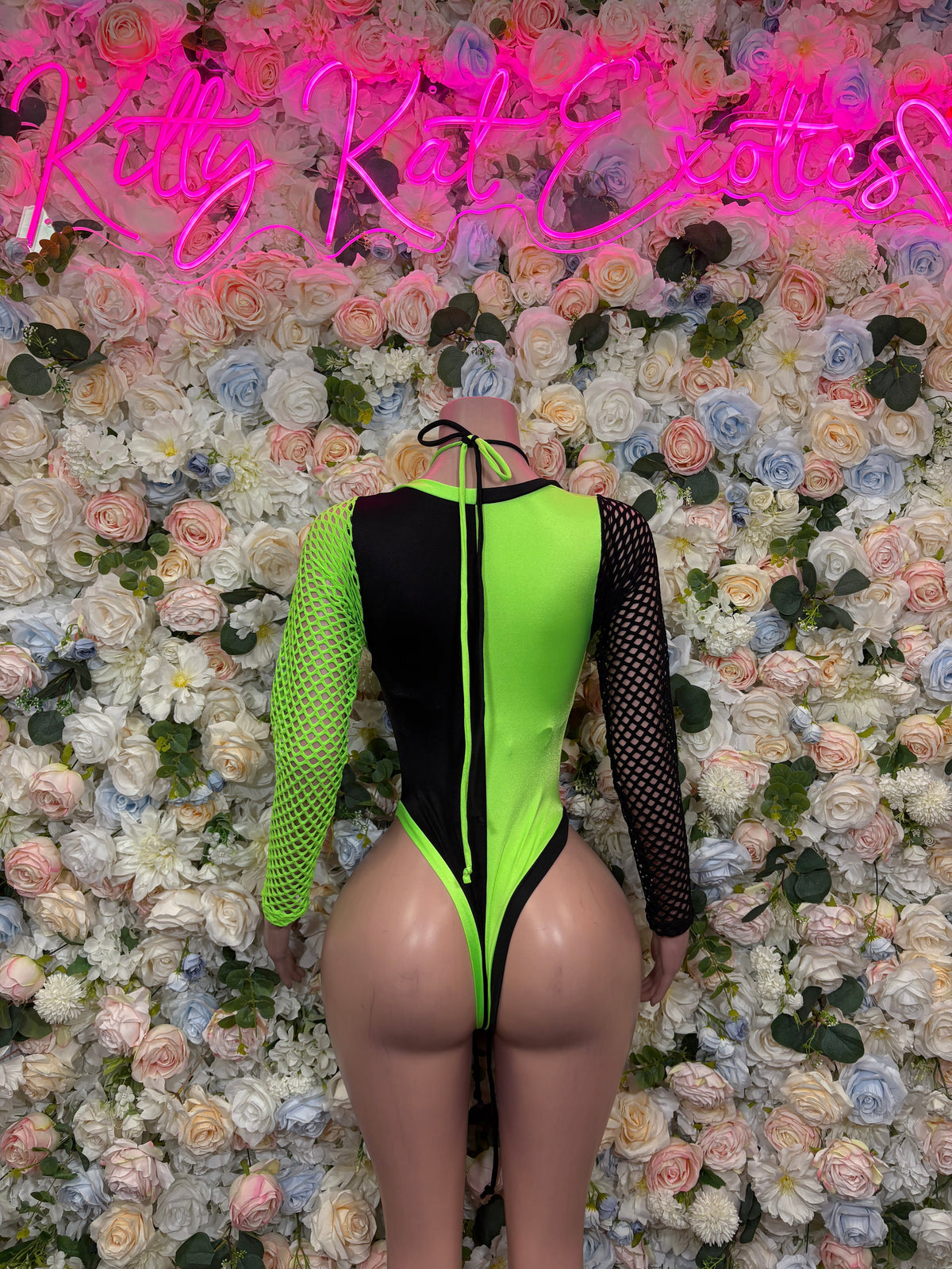 Neon green and black fishnet sleeve bottle girl bodysuit back view