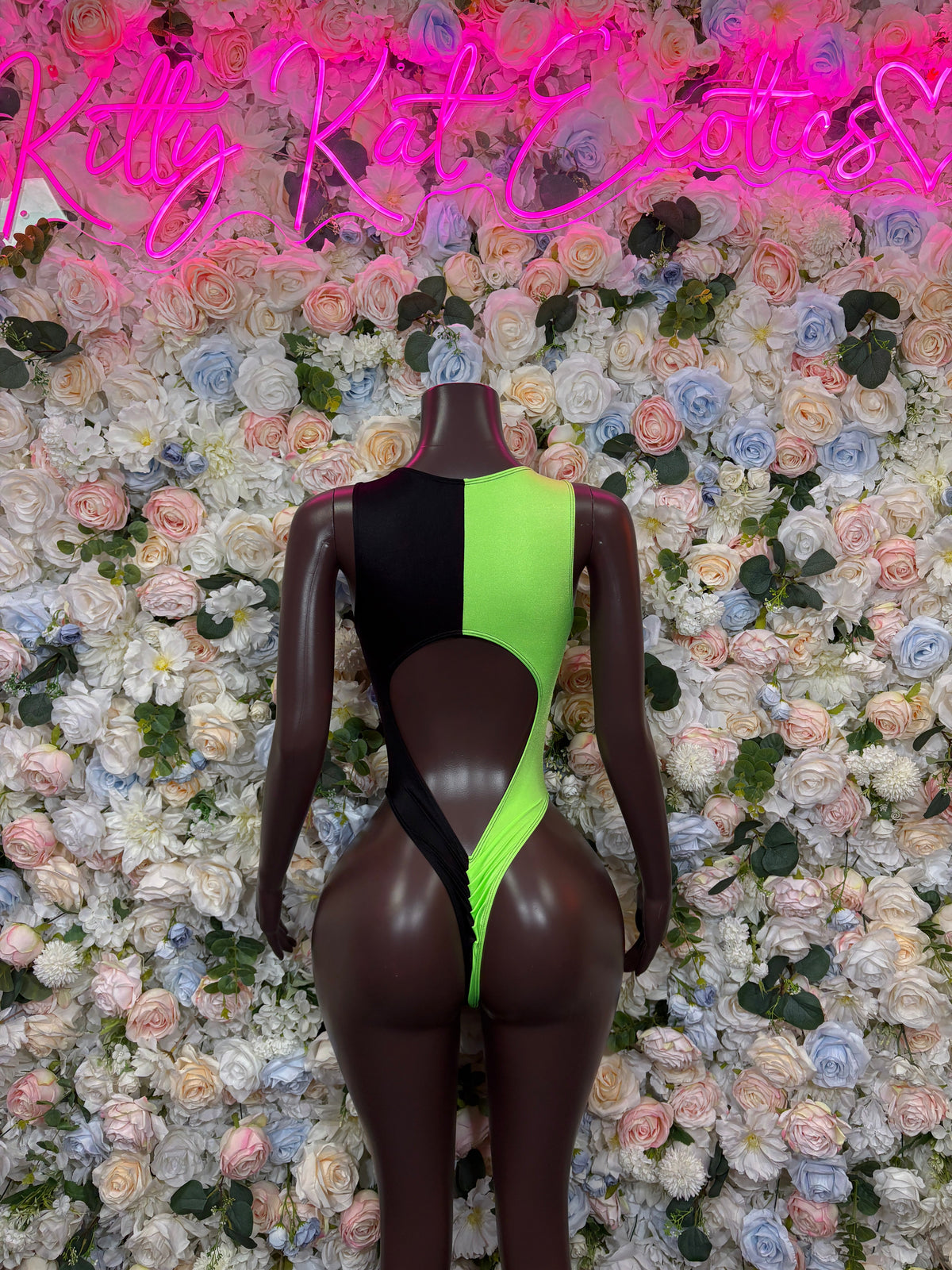 Neon green and black lace up cutout bodysuit back view