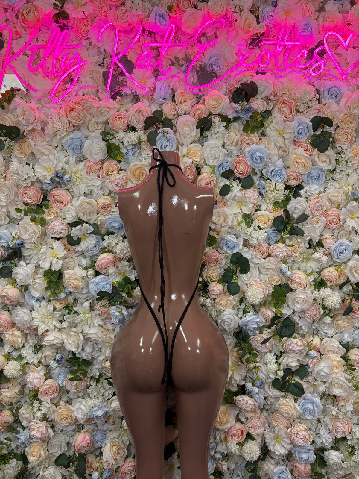 Neon green and black strappy thong bodysuit back view