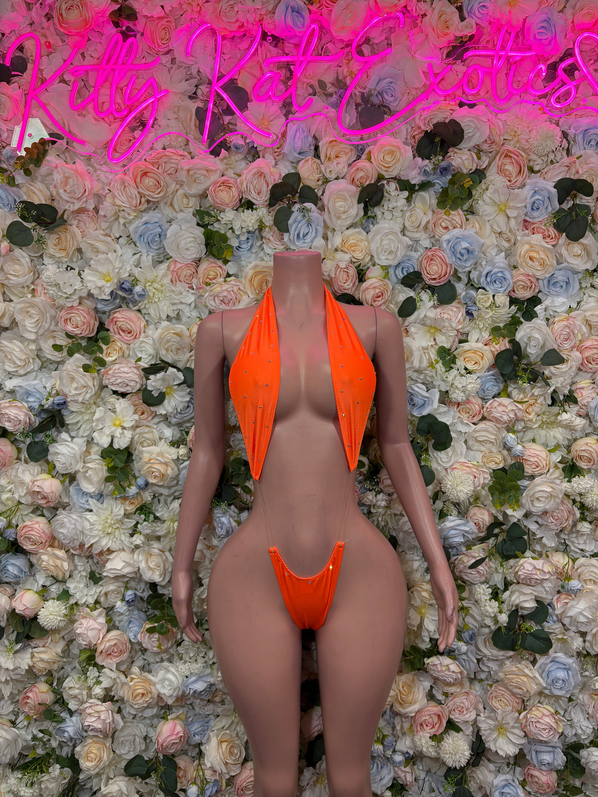 Orange and neon green cross strap rave bodysuit front view