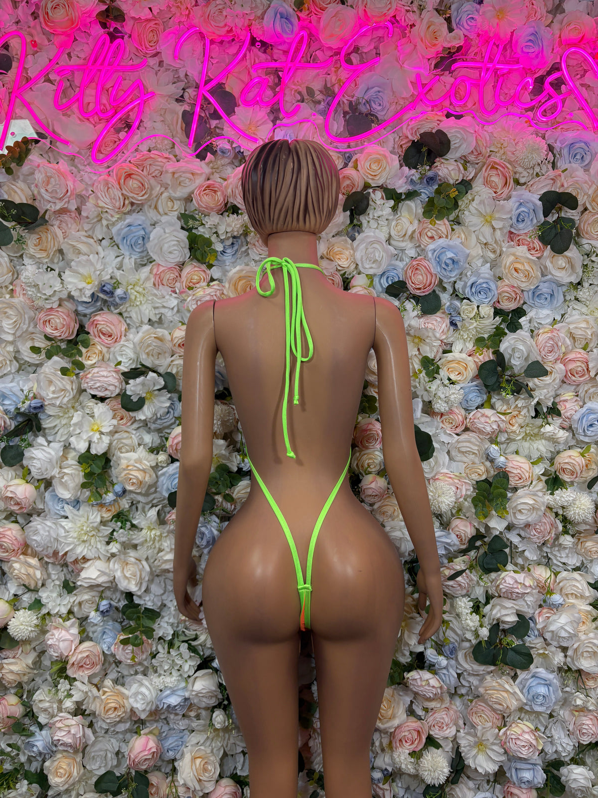 Orange and neon green mesh cutout rave bodysuit back view
