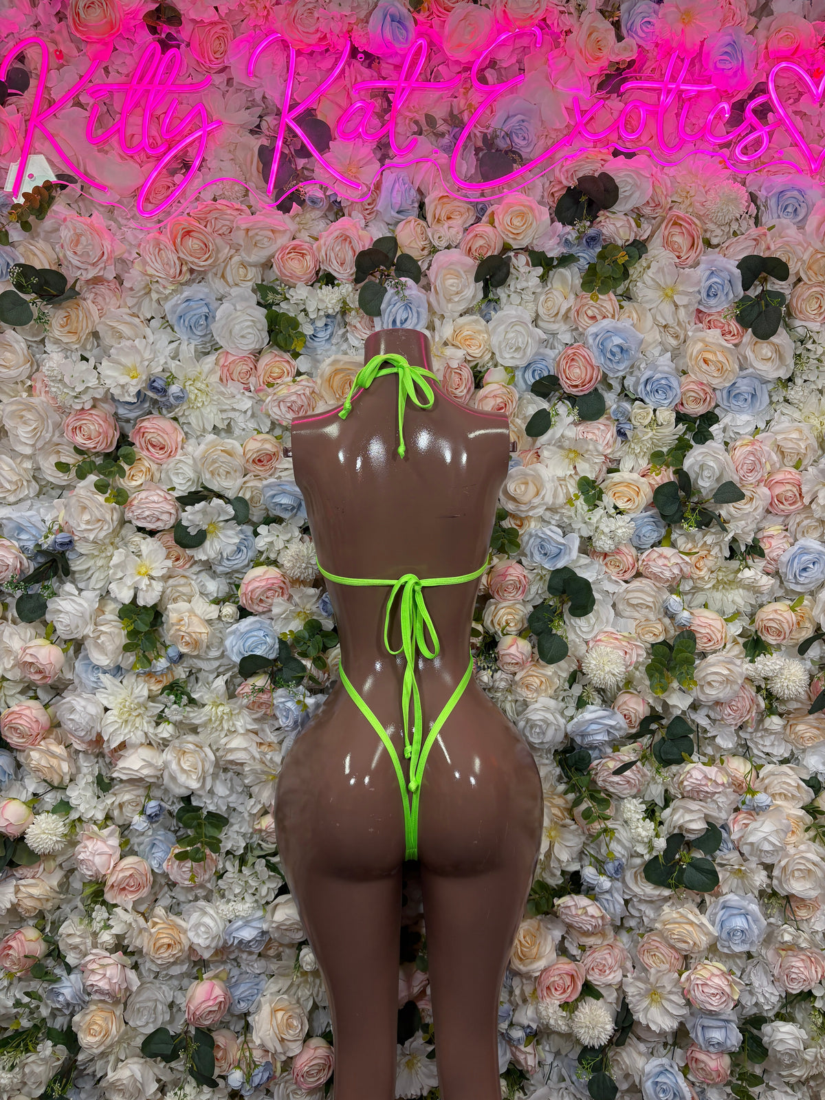 Orange and neon green cutout sling rave bodysuit back view